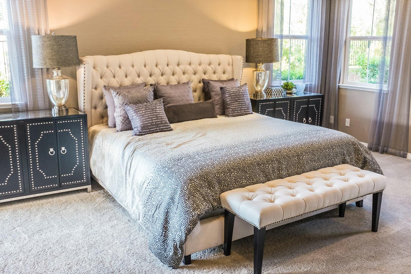 Layered home decor with a warm lamp, chair, and styling accents